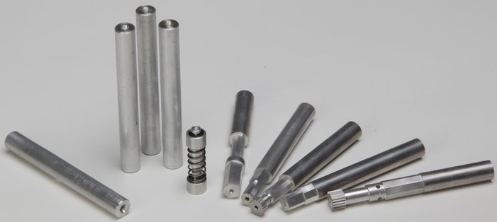 Aluminium rounds with models on a table