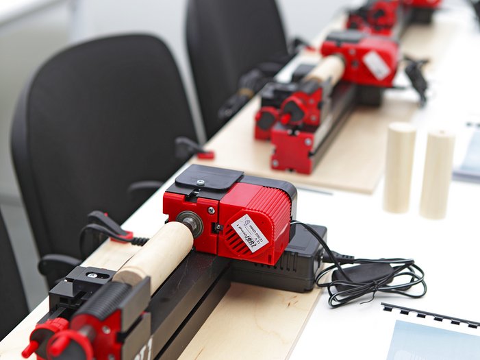unimat wood lathes lined up in a classroom